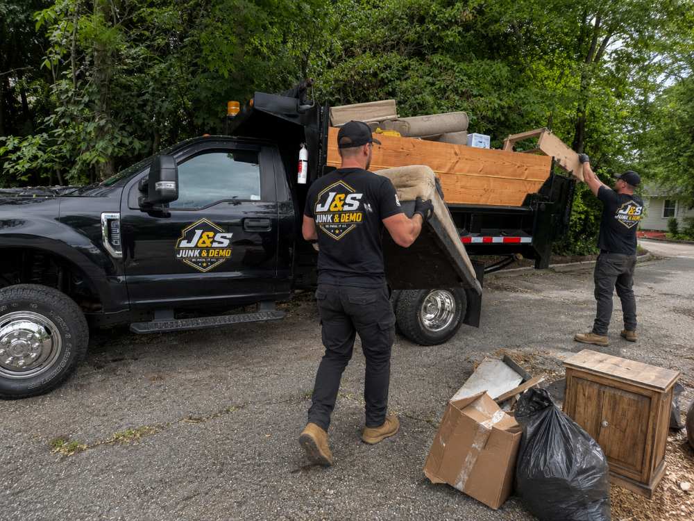 J&S Junk & Demo crew clearing a residential cleanout
